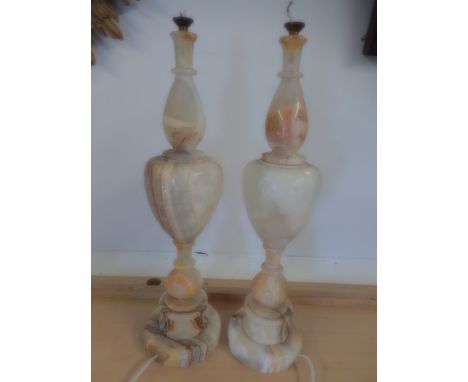 Pair of Alabaster lamp bases 56cm tall, have been repaired in places. .see pics