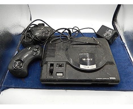 Sega Mega drive 16 bit console with 2 controllers and 7 games ( a/f )