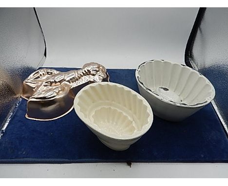 2 ceramic jelly moulds and one tin