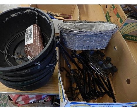 5 plastic hanging baskets, 9 brackets and 3 pot stands with wheels 1 indoor basket planter
