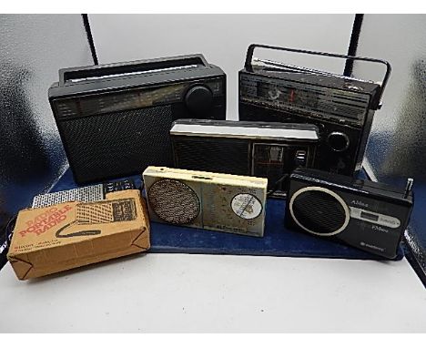 collection of retro radio's and an instamatic camera