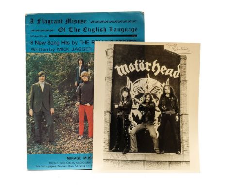 MOTORHEAD : signed photograph by the three members of the band including Lemmy. With - a Rolling Stones song book.(2)