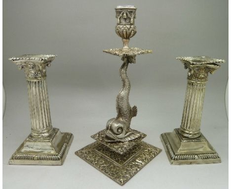 A pair of c.1900 plated candlesticks and a dolphin candlestick