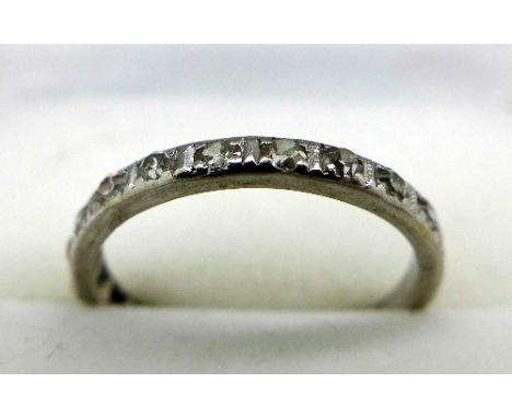 A white metal half eternity ring set with twelve diamonds, weight 2g, size K
