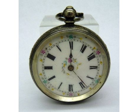 A silver fob watch with decorative dial