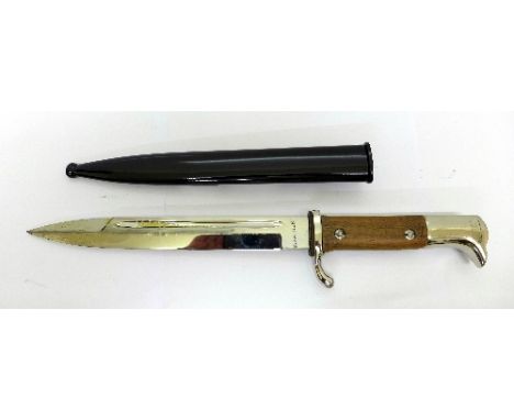 A German World War II dress bayonet, H. Naubert, with scabbard, restored