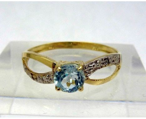 A 9ct gold, blue topaz and diamond ring, weight 1.1g, size O