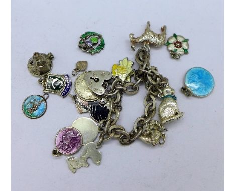 A silver charm bracelet including enamel charms