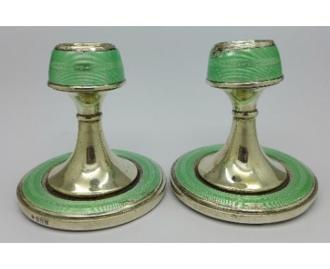 A pair of silver and enamel sticks, a/f, height 8.5cm