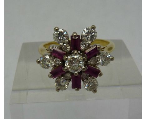 An 18ct gold, ruby and diamond cluster ring, diamond weight 1.1ct, ruby 0.5ct, size N, weight 6.1g