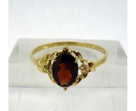 A 9ct gold, garnet and diamond ring, weight 1g, size O