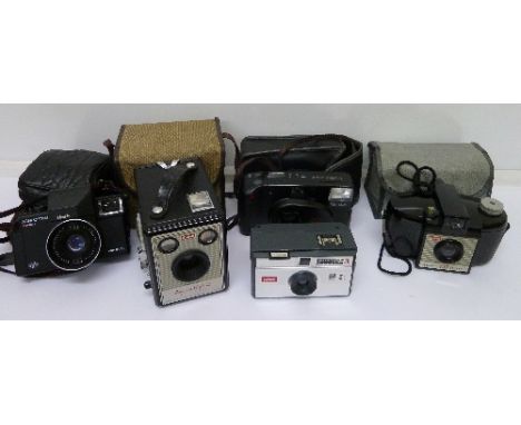 A Kodak Brownie 127 camera, a Kodak Brownie Flash III camera, an Agfa Optima camera, a Kodak Instamatic camera and a Fuji cam