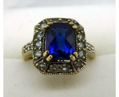 A 9ct gold, blue stone and diamond ring, shoulders set with diamonds, weight 3g, size J