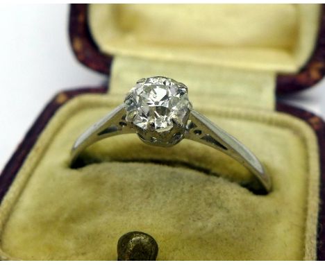 A 1920's platinum and diamond solitaire ring, approximately 0.65ct diamond weight, size T, weight 2.1g