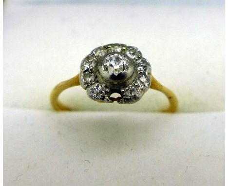 An 18ct gold and diamond ring, weight 1.4g, size F, lacking one stone