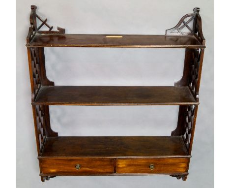 A Chippendale style three-tier mahogany wall shelf with fretwork ends, 79cm high x 62cm wide x 10cm wide, and a French tole p