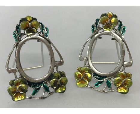 A pair of Art Nouveau style, 925 silver, miniature picture frames with enamelled flower detail. Decorative frames with pull o