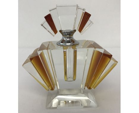 An Art Deco design clear and amber glass fan shaped perfume bottle. With screw lid and dauber. Approx. 12cm tall.