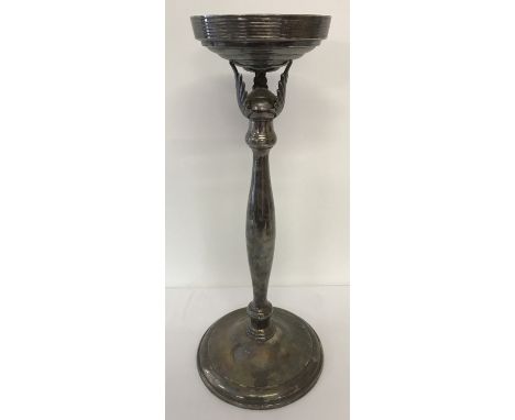 A large silver plated wine cooler/champagne bucket stand with channelled detail to top rim.  Approx. 54cm tall, diameter of t