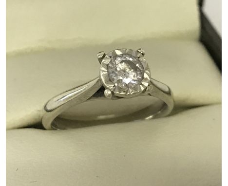 A 9ct white gold diamond solitaire ring. Diamond .33ct. Full hallmarks to inside of band. Size K. Total weight approx. 3.1g.