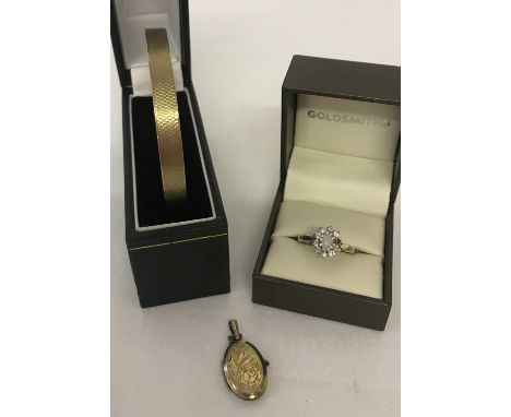 3 items of rolled gold/goldsil jewellery. A bangle with engine turned decoration (marked 9ct bronze core), together with an o