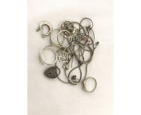 A small collection of scrap silver. To include broken chains, earrings, bracelet padlock &amp; ring mounts. Being sold on beh
