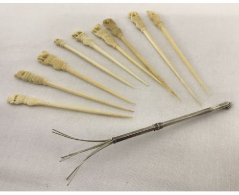 An Art Deco silver propelling cocktail swizzle stick/stirrer. Hallmarked Birmingham 1934.Together with 9 vintage carved cockt