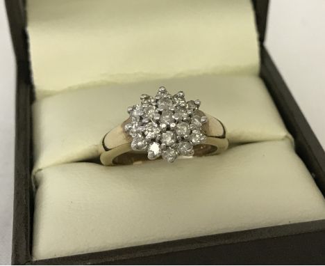 A 9ct gold .50 ct diamond cluster dress/engagement ring. Size I.  Total weight approx. 3.6g.