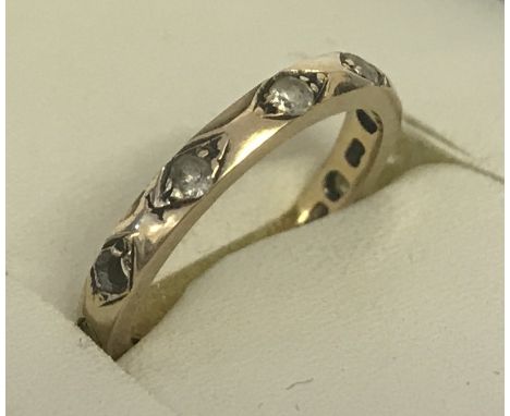 A vintage 9ct gold and clear stone full eternity ring. One stone missing. Total weight approx. 1.6g. Size I 1/2.