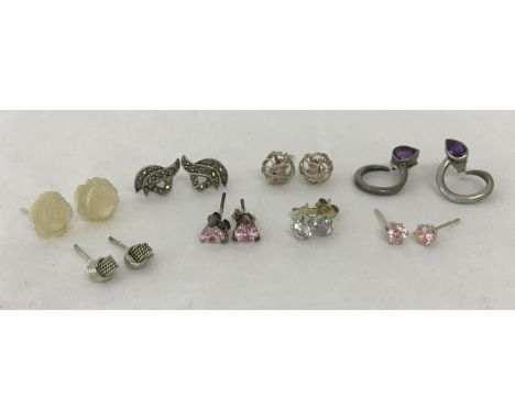 8 pairs of silver stud style earrings, some stone set. To include amethyst set studs with twist design, marcasite set and car