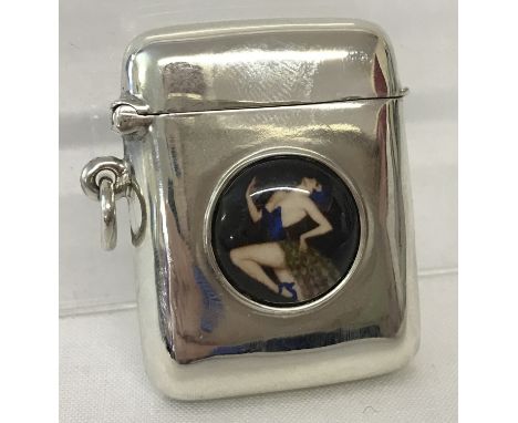 A small square shaped 925 silver vesta case set with circular ceramic disc. Disc depicts a glamourous woman wearing a peacock