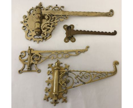 4 Victorian and vintage brass wall mountable lamp hooks. With folding decorative arms. Largest approx. 20cm x 38cm.