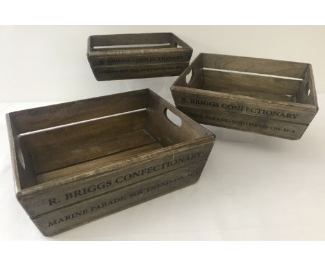 A set of 3 vintage style, 2 handled wooden advertising candy floss trays. Writing on sides for "R. Briggs Confectionary, Mari