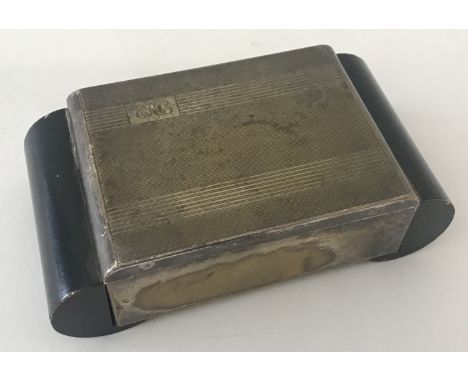 A vintage silver plated table top cigarette box with engine turned engraving &amp; monogrammed initials.  Approx. 5cm x 15.5c