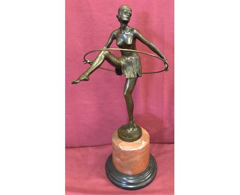 After Alonzo, an Art Deco style bronze of a dancing Hoop Girl. Mounted on 2 tier circular marble base. Approx. 48cm tall.