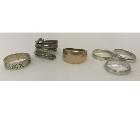 6 silver and white metal band style rings. To include a serpent design ring.  Total weight 23.7g.