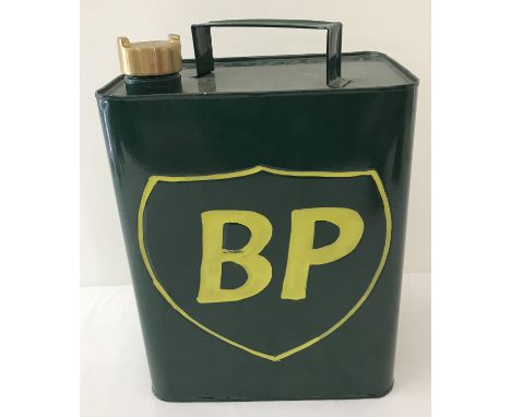 A painted green 2 gallon BP petrol can with brass screw lid.  
