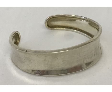 A 925 silver cuff bangle. Hallmarks to inside rim.  Total weight approx. 10.1g.