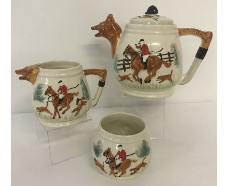 A circa 1940's 3 piece Paramount Potteries Co tea set with hunting design. Comprising: teapot and milk jug with fox head shap