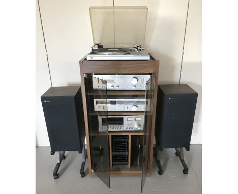 A collection of JVC Hi-Fi separates together with a Hi-Fi unit and a pair of Celestion speakers. Speakers on wheeled stands. 