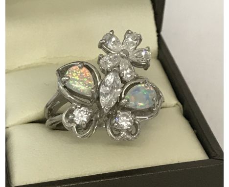 A 925 silver dress ring set with cubic zirconia and opal stones in the shape of a butterfly &amp; flower  Ring size S.