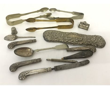 A small collection of silver and silver plate items. To include a clothes brush back Hallmarked Chester and butter knife hand