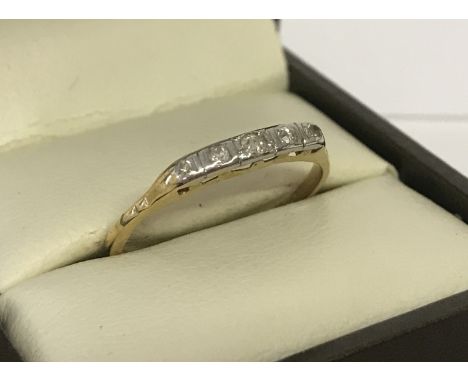 A vintage 18ct gold and diamond eternity style ring. Set with 5 graduating size diamonds. Size O½. Total weight approx 1.1g