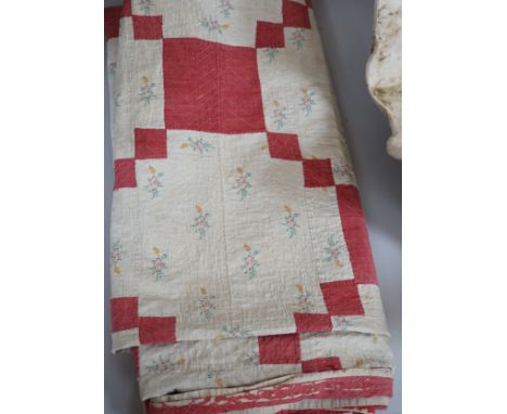 A mid to late 19th century hand stitched patch worked  quilt,210 cms x 200 cms,