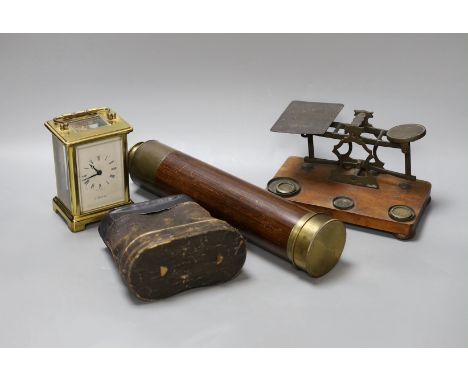 A five draw telescope, a pair of cased binoculars, postal scales and a brass timepiece,telescope drawn 69 cms long,