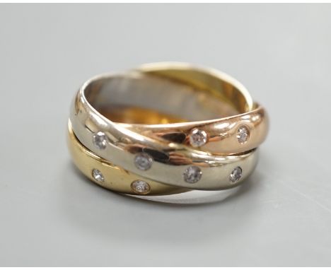 A modern Italian 750 and gypsy set diamond Russian triple wedding band, size J/K, gross weight 7.6 grams.