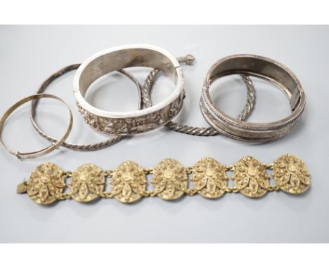 A Chinese white metal hinged bangle and five other items, including an engraved silver hinged bangle.