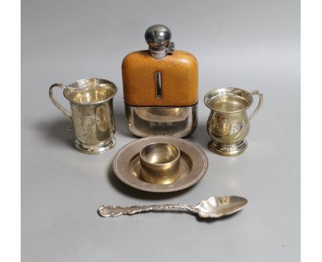 Two small George V christening mugs, a small modern silver armada dish, a silver napkin ring, ornate silver spoon and a silve