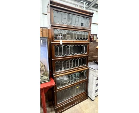 A Globe Wernicke six section mahogany bookcase with leaded glazed doors, length 87cm, depth 29cm, height 206cm