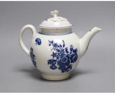 A Caughley teapot and cover printed in underglaze blue with the Three Flowers pattern, S mark in blue to base,17 cms high,